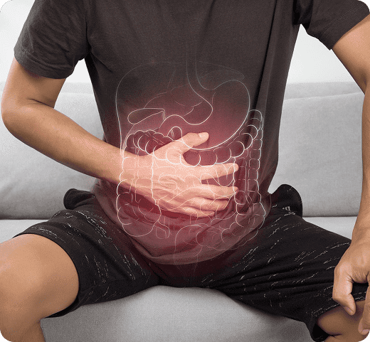 Person holding their abdomen with a digestive system illustration overlay, highlighting stomach and intestinal pain related to Bowel Cancer symptoms and gastroenterology care.